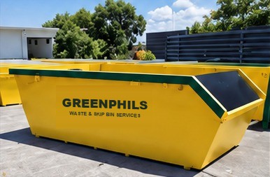 Greenphils yellow skip bin on site